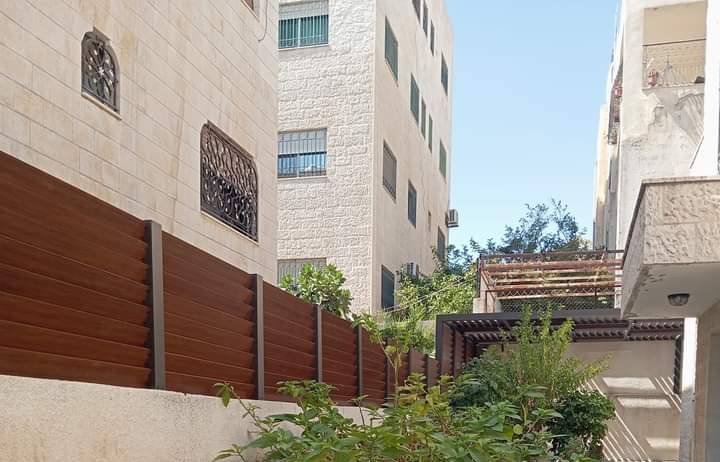 Custom Design & Installation: Aluminum Wood Finish Gates, Fences, Garage Doors, and Seasonal Pergolas - الصورة 25