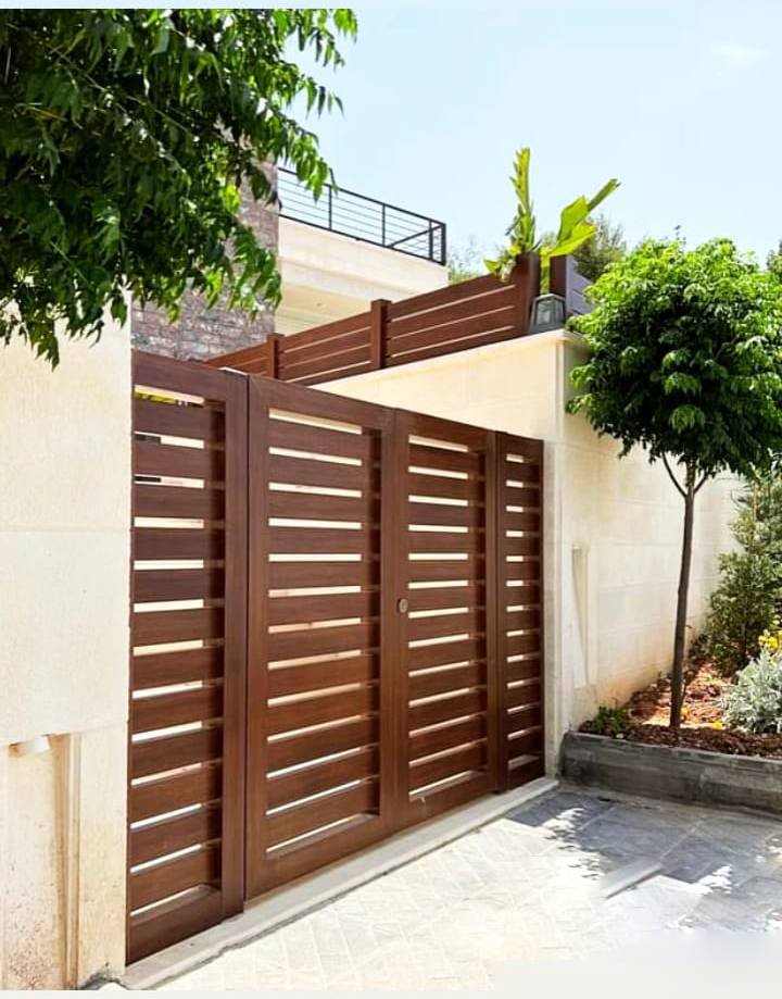 Custom Design & Installation: Aluminum Wood Finish Gates, Fences, Garage Doors, and Seasonal Pergolas - الصورة 21